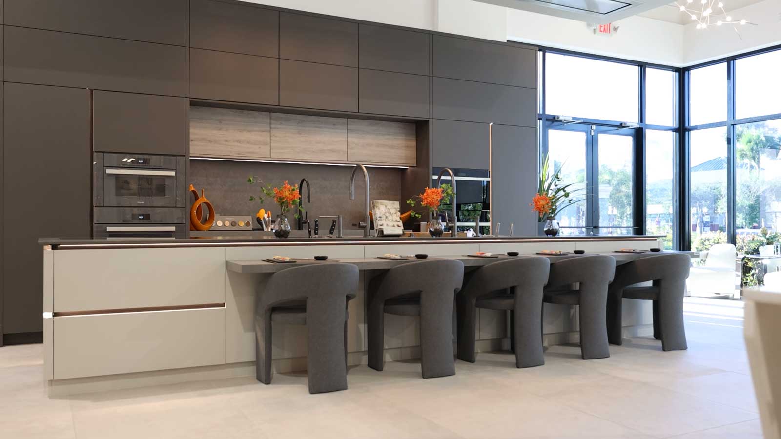 Elegant Modern Kitchen with Grey Cabinets and Matching Bar Stools